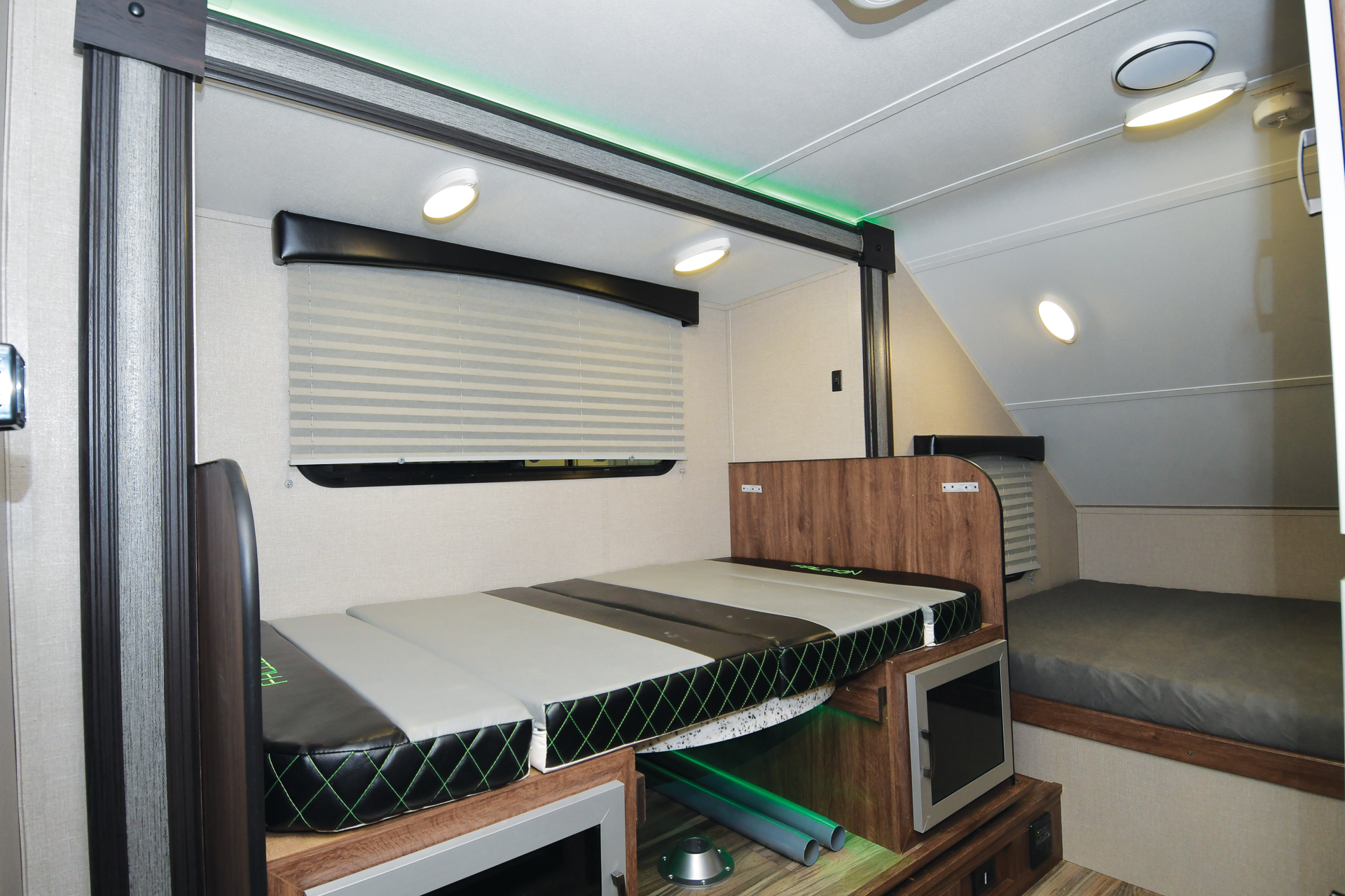 The Falcon GT dinette slide gives this trailer extra interior space. With the dinette seats up you can enjoy a meal, watch the 32" TV, and relax after a day on the road.