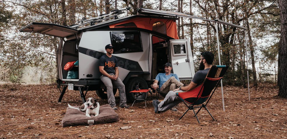Relaxing at the campsite with friends, TAXA Cricket Overland trailer
