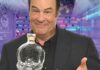 Photo of Dan Akroyd holding a bottle of Crystal Head Vidka at the Mariott Rousseau Icebar