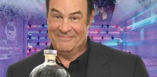 Photo of Dan Akroyd holding a bottle of Crystal Head Vidka at the Mariott Rousseau Icebar