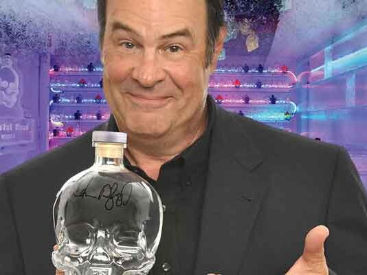 Photo of Dan Akroyd holding a bottle of Crystal Head Vidka at the Mariott Rousseau Icebar