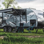 web-2023-Venture-RV-Sonic-X-SN220VRBX-Travel-Trailer-at-Campsite