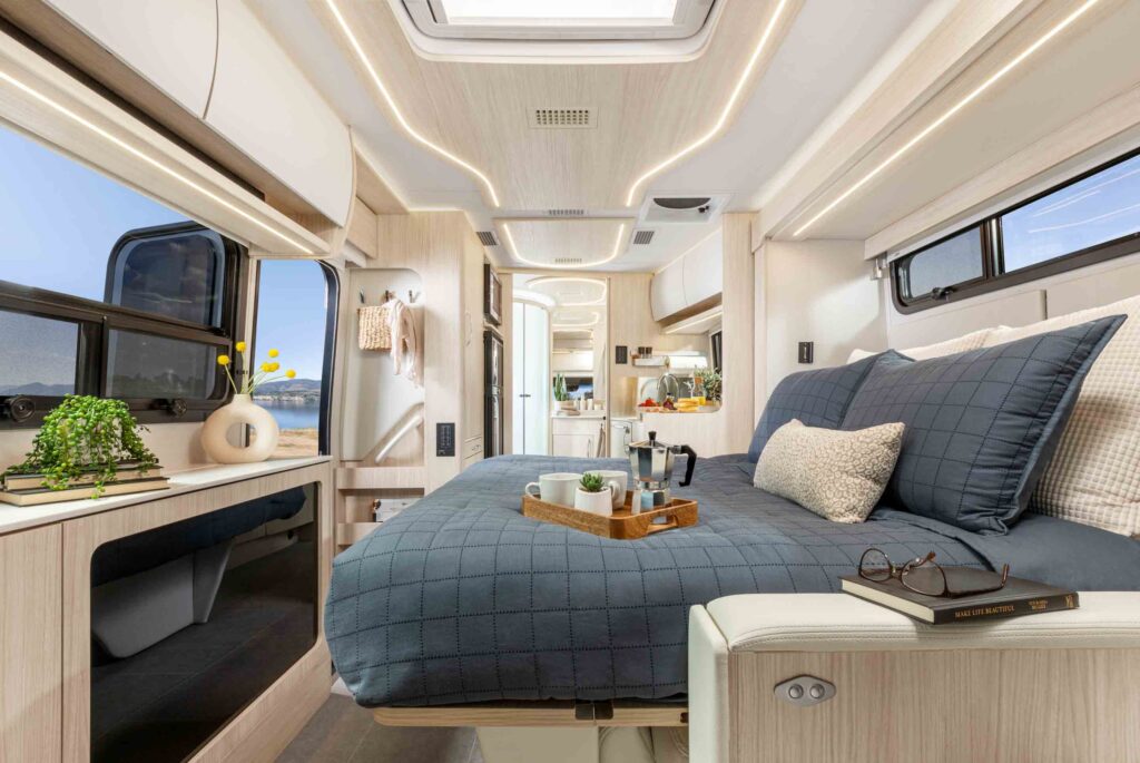 Leisure Travel Vans 2023 Unity Murphy Bed Lounge - interior view,with bed in sleeping configuration.