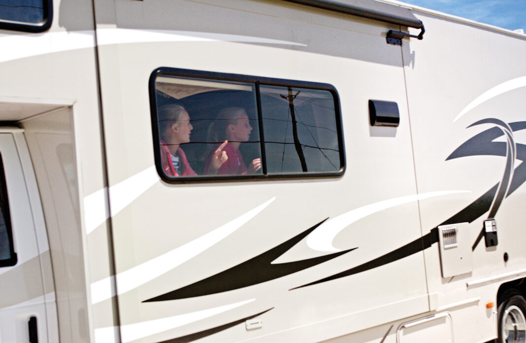 RVing with kids - the window seat is always the preferred spot for kids in RVs.