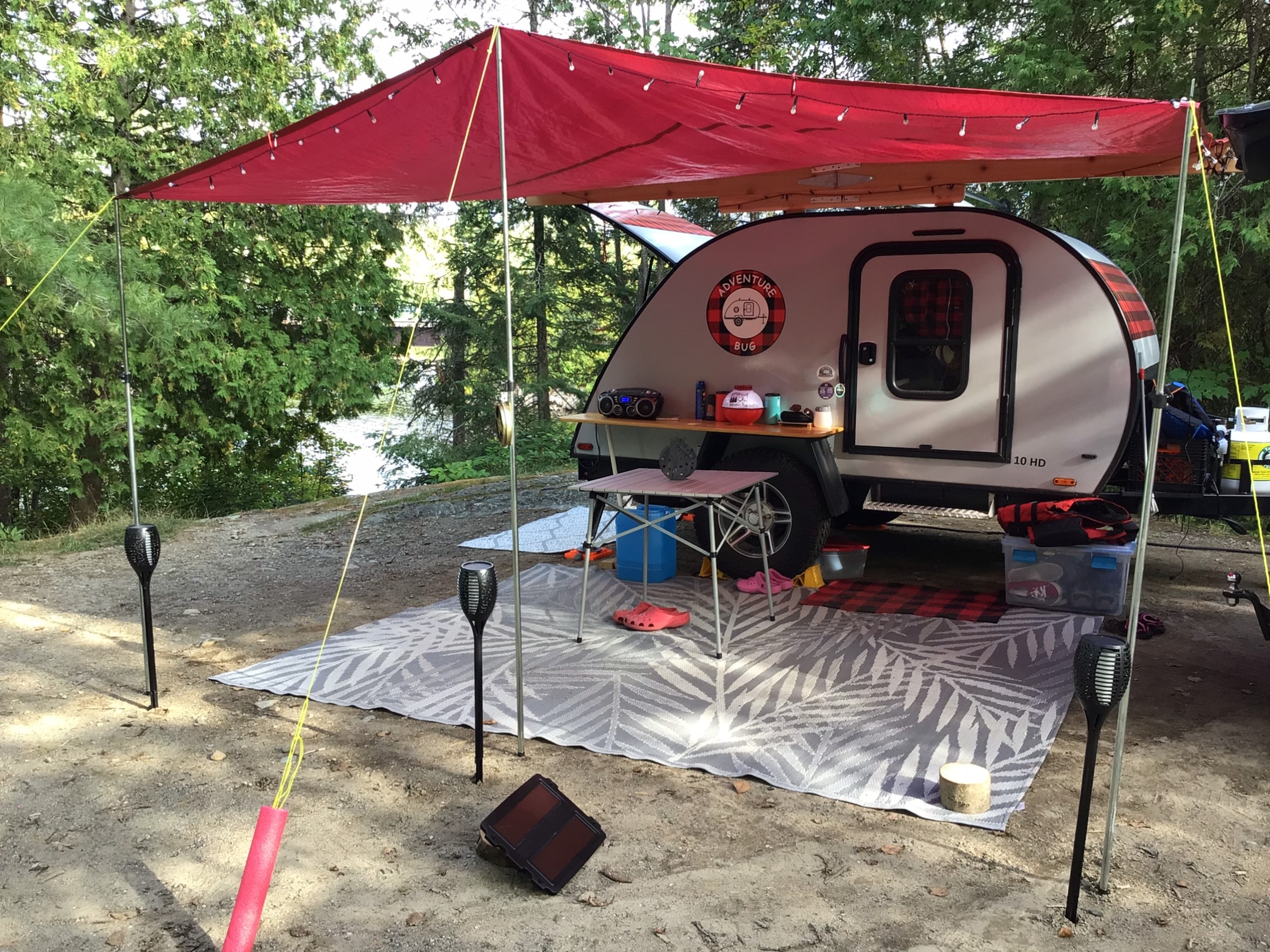 Adventure Bug - with D-I-Y canopy, wheel well shelf, picnic tables, and campsite rug.