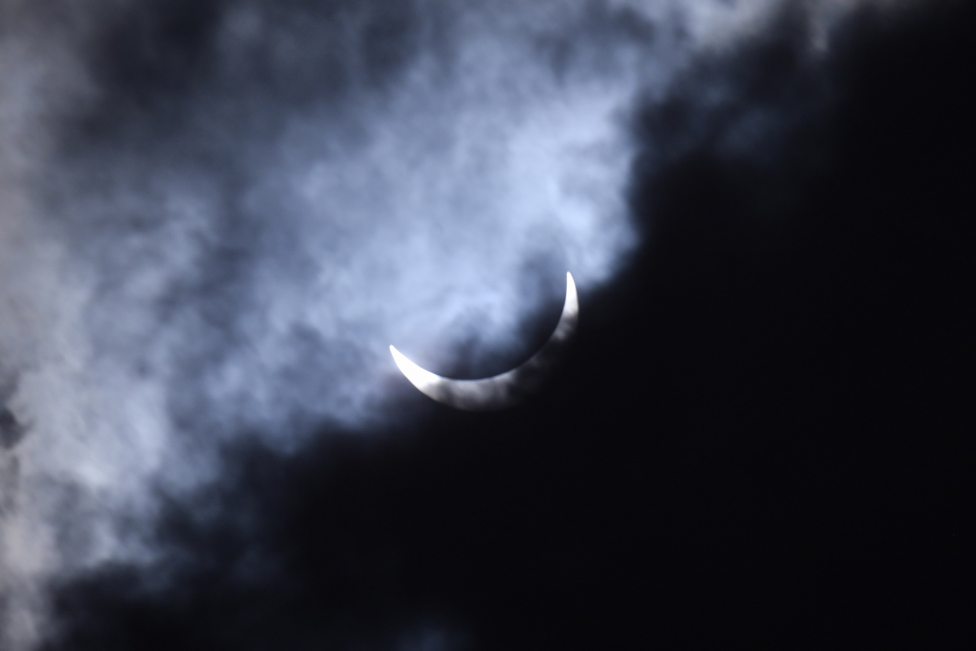 By 3:30 pm, the moon had transited the sun, and was entering the final phase of the eclipse. The clouds added a beautifully eerie tone to the image