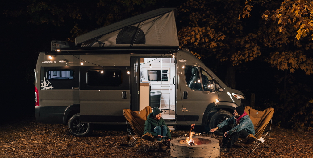 Family camping - campfire image showing 2024 Westfalia Wave Pop-Top
