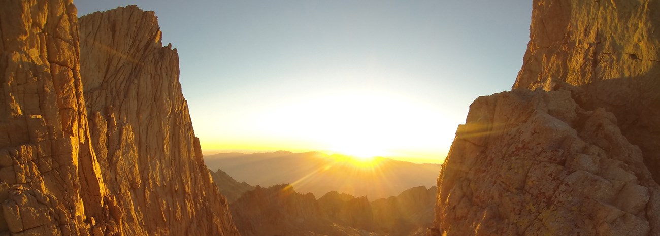 A sunrise illuminates rocky peaks - Whitney Sunrise. Photo by Steven Gadecki, courtesy National Park Service.