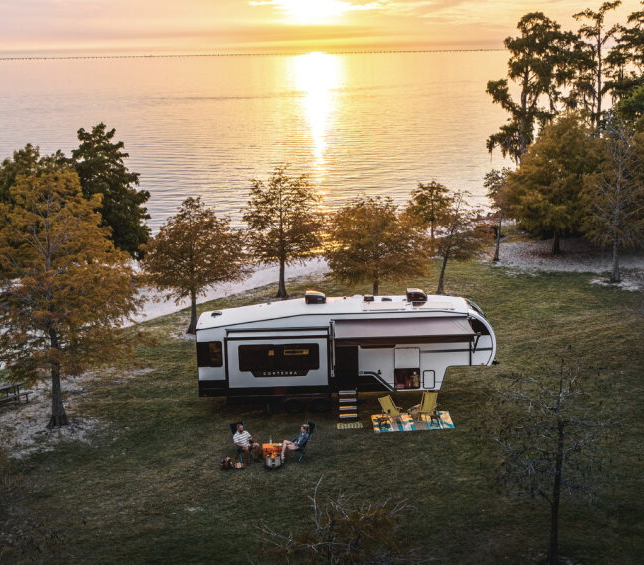 Heartland RV's new Corterra 3.0 fifth wheel travel trailer exterior view in a campsite setting.