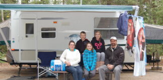 The Coles family with their first travel trailer. Photo by Cheryl Coles.