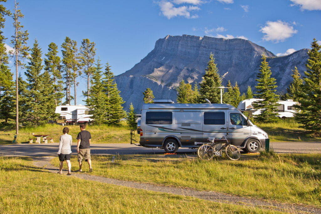 Banff National Park - a couple walking in Tunnel Mountain
Campground Trailer Court early
summer evening in Banff National
Park. Photo © Parks Canada / Stefanie
Gignac