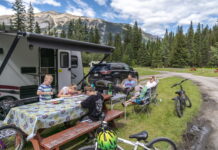 Parks Canada – Summer 2025 Yoho National Park - A family relaxes at their campsite in Kicking Horse Campground, Yoho National Park. Photo © Parks Canada / Zoya Lynch