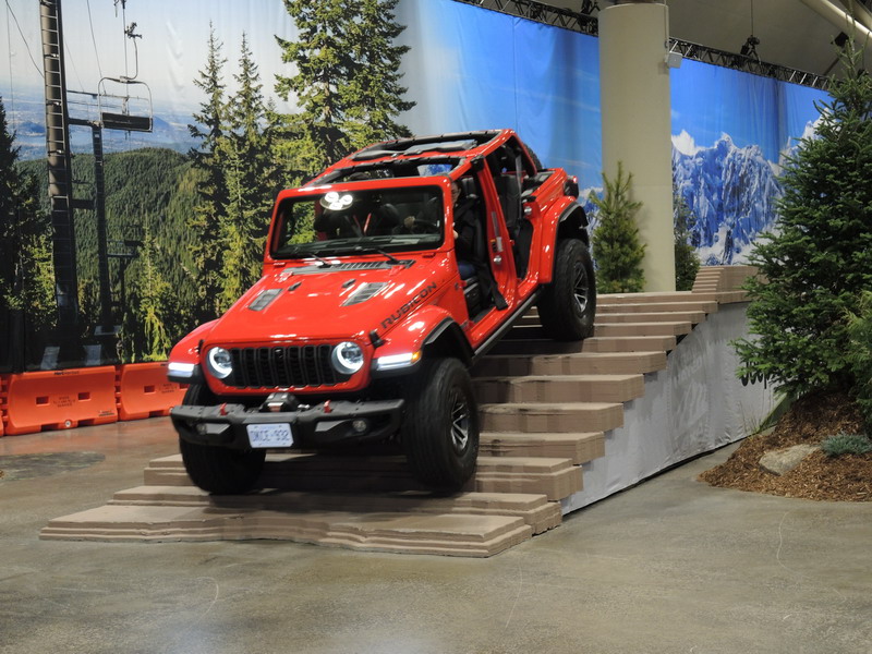 Journalists take the 2026 Jeep Gladiator through its paces at the Camp Jeep display, during the Canadian International AutoShow.