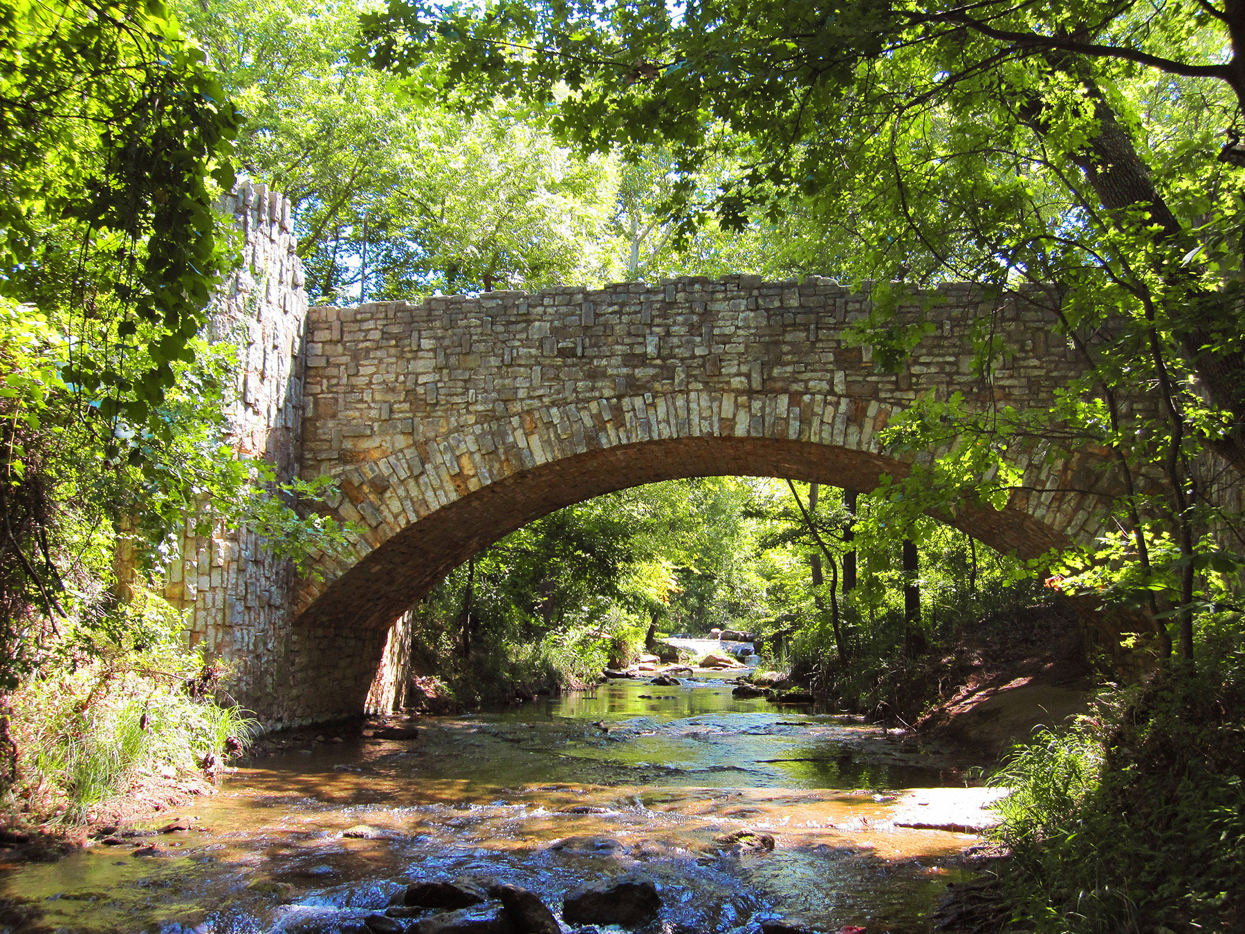 A bridge over a River at Chickasaw National Recreation Area